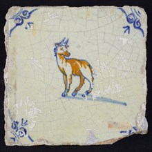 Animal tile, go to the left with the head turned to the right, in blue and brown on white, corner pattern ossenkop, wall tile
