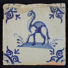 Animal tile, dromedary left on ground, in blue on white, corner design large ox head, wall tile tile sculpture ceramics pottery