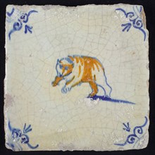 Animal tile, leaping bear to the left, blue and brown on white, corner motif ox's head, wall tile tile sculpture ceramic