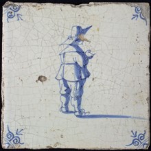 Figure tile, blue with standing man seen on the back, big hat, corner pattern ox's head, wall tile tile sculpture ceramic