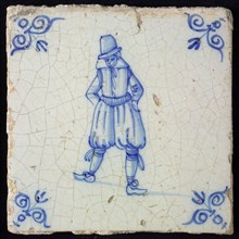 Figure tile, blue with standing man with breeches, corner pattern ox's head, wall tile tile sculpture ceramic earthenware glaze