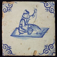 Occupation tile, blue with seated tailor, corner motif oxen head, wall tile tile sculpture ceramic earthenware glaze wood, baked