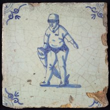 Occupation tile, blue with man dragging big fish, salmon fisherman, Corner motif oxen head, wall tile tile sculpture ceramic