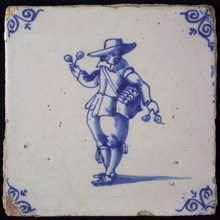 Occupation tile, blue with spectacle vendor, corner motif oxen head, wall tile tile sculpture ceramic earthenware glaze wood