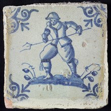 Figure tile, blue with warrior on ground, attacking with trident, corner motif oxen head, wall tile tile sculpture ceramic