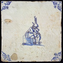Figure tile, blue with bagpipe player, sitting on block, corner motif oxen head, wall tile tile sculpture ceramic earthenware