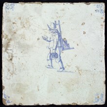 Figure tile, blue with hawker with rack with merchandise on the back, corner motif oxen head, wall tile tile sculpture ceramic