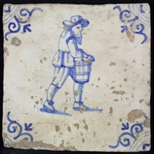 Figure tile, blue with running figure with beard and bucket on the arm, corner motif oxen head, wall tile tile sculpture ceramic
