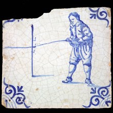 Figure tile, proverb, blue with man who lays slat on stand, 'raise the bar', Corner pattern ox head, wall tile tile sculpture