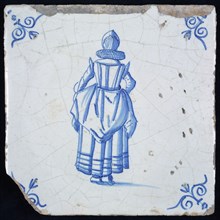 Figure tile, blue with lady with millstone collar and recorded overcoat, seen from the back, corner pattern ox's head, wall tile