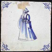 Figure tile, blue with lady with long dress, cloth in one, bucket in the other hand, corner pattern ox-head, wall tile