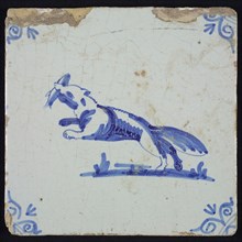 Animal tile, jumping fox to the left with fish in its mouth, in blue on white, corner motif of ox's head, wall tile