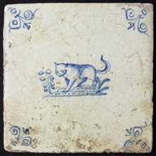 Animal tile, running lion to the left on plot, in blue on white, corner motif; stalked ox head, wall tile tile sculpture ceramic