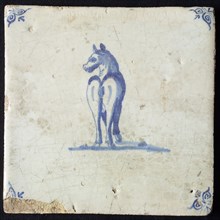 Animal tile, standing horse seen from behind with head turned to the left, in blue on white, corner pattern ox head, wall tile