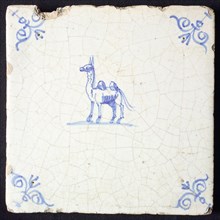 Animal tile, standing camel to the left, in blue on white, corner patterned ox-head, wall tile tile sculpture ceramic