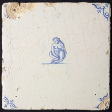 Animal tile, sitting monkey to the left, in blue on white, corner patterned ox-head, wall tile tile sculpture ceramic