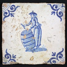 Figure tile, blue with woman with barrel of fish, Corner motif ox's head, wall tile tile sculpture ceramic earthenware glaze