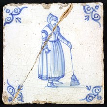 Figure tile, blue with peasant woman with broom, corner motif ox's head, wall tile tile sculpture ceramic earthenware glaze