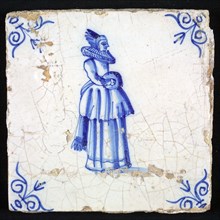 Figure tile, blue with nicely dressed lady with millstone collar, slipped skirt and sleeve, corner pattern ox head, wall tile
