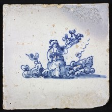 Figure tile, blue with seated woman surrounded by fruit, with basket and fruit in her hand, fruit seller, no corner pattern