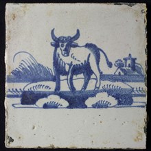 Animal tile, standing ox to the left on continuous plot, buildings with tower in the background, in blue on white, no corner