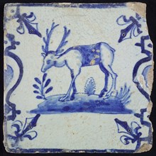 Animal tile, standing deer to the left on plot between balusters, in blue on white, corner pattern French lily, wall tile