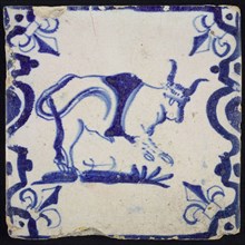 Animal tile, jumping bull to the right on ground between balusters, in blue on white, corner pattern French lily, wall tile