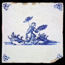 Scene tile, blue, with landscape containing man holding his hat on stick and holding garland In his hands, corner pattern spider