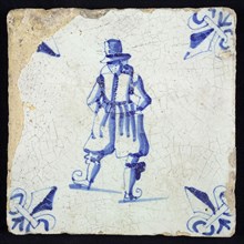Figure tile, blue with skater in prominent clothing, corner pattern lily, wall tile tile sculpture ceramic earthenware glaze