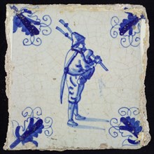 Figure tile, blue with bagpipe player, corner motif, vane leaf, wall tile tile sculpture ceramic earthenware glaze, baked 2x