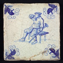 Figure tile, blue with disabled man with stool, sitting on bench, drinking from jug, corner motif, vane leaf, wall tile