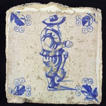 Figure tile, blue with standing nobleman with shovel, corner motif, vane leaf, wall tile tile sculpture ceramic earthenware