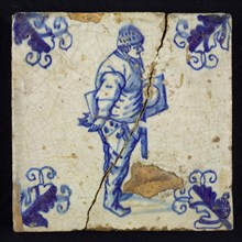 Figure tile, blue with standing man with shelf or table under the arm, corner motif, vane leaf, wall tile tile sculpture ceramic