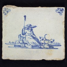 Figure tile, blue with landscape with shepherdess with revealing body, sitting on stone, corner motif spider, wall tile