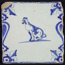 Animal tile, sitting dog to the left between balusters, in blue on white, corner pattern french lily, wall tile tile sculpture