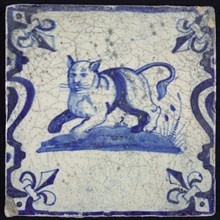 Animal tile, running lion or cat to the left on plot between balusters, in blue on white, corner pattern French lily, wall tile