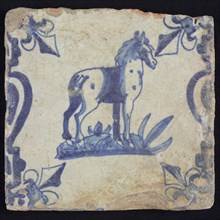 Animal tile, standing horse to the right on ground between balusters, in blue on white, corner pattern french lily, wall tile