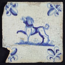 Animal tile, standing dog to the left on plot in blue on white, corner pattern French lily, wall tile tile sculpture ceramic