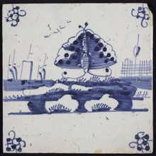Animal tile, flying butterfly above continuous ground, left three sailing ships in the background, in blue on white, corner