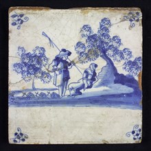 Figure tile, blue with amorous shepherd scene with standing shepherd and sitting shepherdess, corner motif spider, wall tile