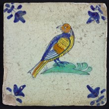 Animal tile, bird on ground in orange, yellow, green and blue on white, corner pattern french lily, wall tile tile sculpture