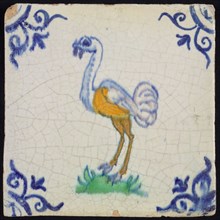 Animal tile, bird on ground to the left in orange, green and blue on white, corner pattern ox head, wall tile tile sculpture