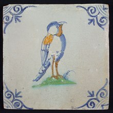Animal tile, bird with on ground to the right in orange, yellow, green and blue on white, corner pattern ox head, wall tile
