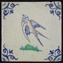 Animal tile, flying bird to the left in purple, green and blue on white, corner motif ox's head, wall tile tile sculpture