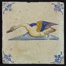 Animal tile, bird in water to the left in orange, purple and blue on white, corner motif ox's head, wall tile tile sculpture