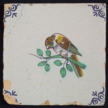 Animal tile, bird on branch to the left in yellow, purple, brown, green and blue on white, corner pattern ox head, wall tile