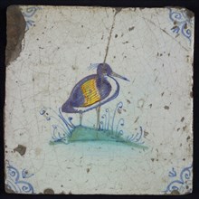Animal tile, bird on piece of land to the right in yellow, orange, green and blue on white, corner pattern ossenkop, wall tile