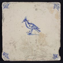 Animal tile, crested bird to the left, blue on white, corner motif ox's head, wall tile tile sculpture ceramic earthenware glaze
