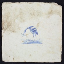 Animal tile, bird on plot with long fish in its beak to the left, blue on white, no corner pattern, wall tile tile sculpture