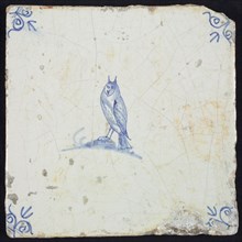 Animal tile, bird on ground to the left, in blue on white, corner motif ox's head, wall tile tile sculpture ceramic earthenware